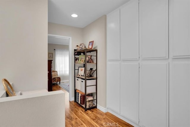 12 Sparrow Hill Ln, Laguna Hills, CA 92653 - hallway with light wood-type flooring and baseboards