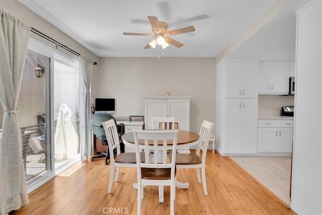 12 Sparrow Hill Ln, Laguna Hills, CA 92653 - dining area featuring a ceiling fan and light wood-style floors
