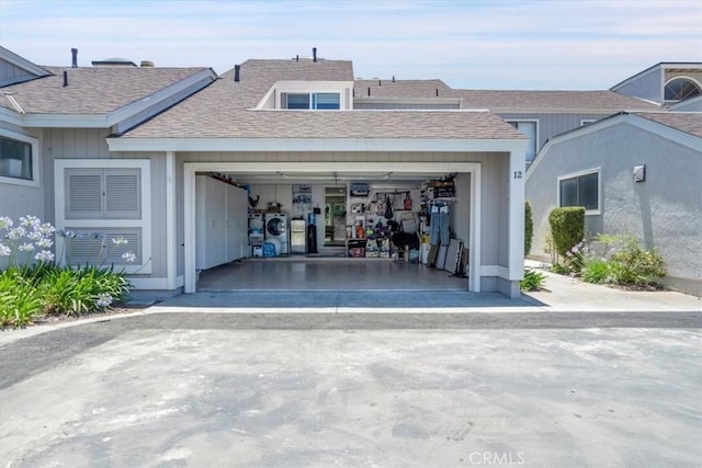 12 Sparrow Hill Ln, Laguna Hills, CA 92653 - garage featuring concrete driveway and washer and dryer