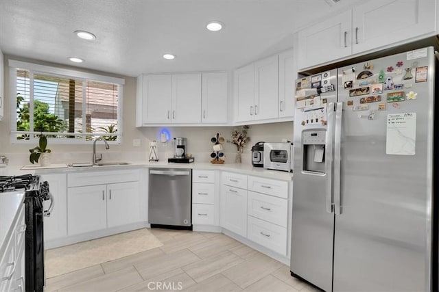12 Sparrow Hill Ln, Laguna Hills, CA 92653 - kitchen with stainless steel appliances, white cabinets, light countertops, and recessed lighting