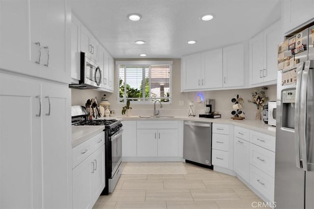 12 Sparrow Hill Ln, Laguna Hills, CA 92653 - kitchen featuring stainless steel appliances, recessed lighting, white cabinetry, and light countertops