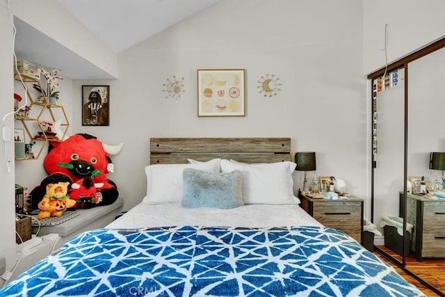 12 Sparrow Hill Ln, Laguna Hills, CA 92653 - bedroom featuring a closet, lofted ceiling, and wood finished floors