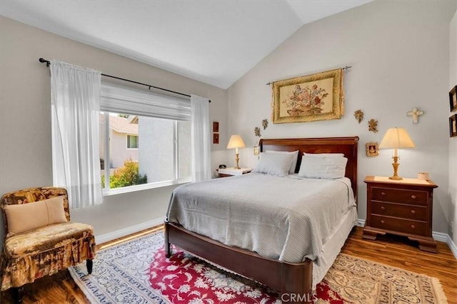 12 Sparrow Hill Ln, Laguna Hills, CA 92653 - bedroom featuring lofted ceiling and wood finished floors