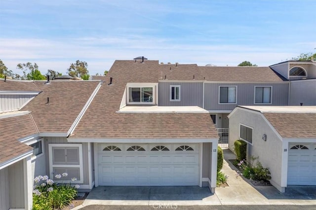 12 Sparrow Hill Ln, Laguna Hills, CA 92653 - multi unit property with roof with shingles, a garage, and driveway