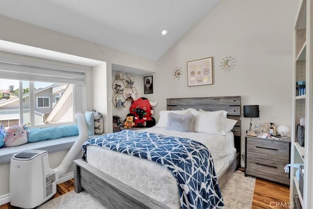12 Sparrow Hill Ln, Laguna Hills, CA 92653 - bedroom featuring lofted ceiling, wood finished floors, and recessed lighting