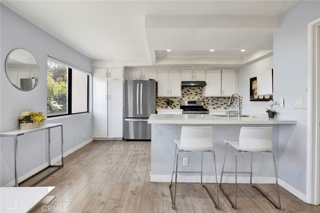 5533 Edward E Horton Ln Unit 6, Encino, CA 91316 - kitchen with stainless steel appliances, white cabinetry, backsplash, light countertops, and recessed lighting