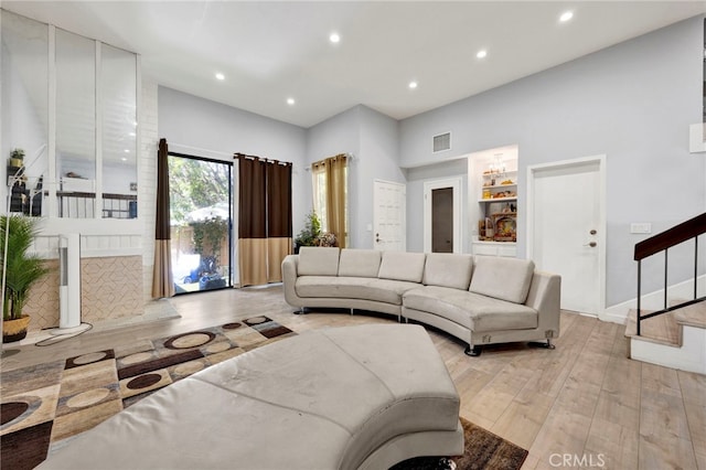 5533 Edward E Horton Ln Unit 6, Encino, CA 91316 - living room featuring stairway, recessed lighting, light wood-style floors, and a high ceiling