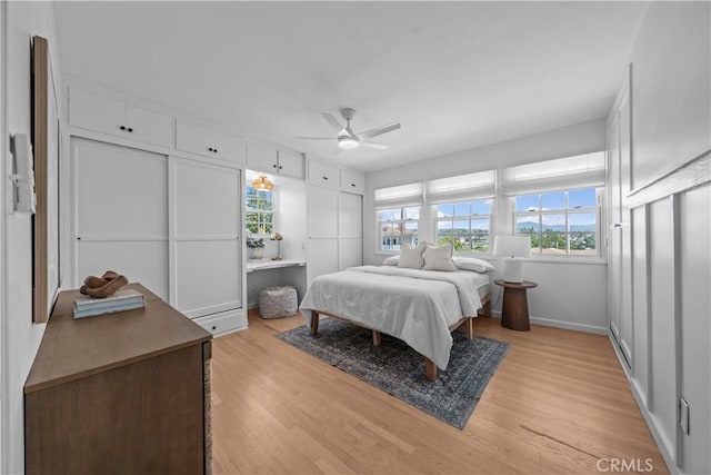 6335 Lorca Dr, San Diego, CA 92115 - bedroom featuring multiple windows, light wood-style floors, and a ceiling fan