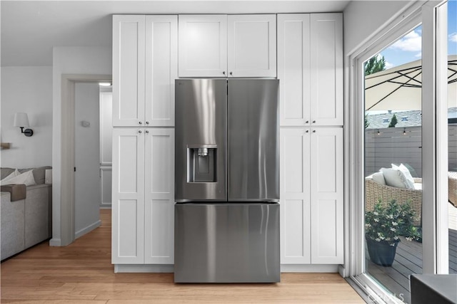 6335 Lorca Dr, San Diego, CA 92115 - kitchen featuring stainless steel fridge, light wood-style flooring, and white cabinetry