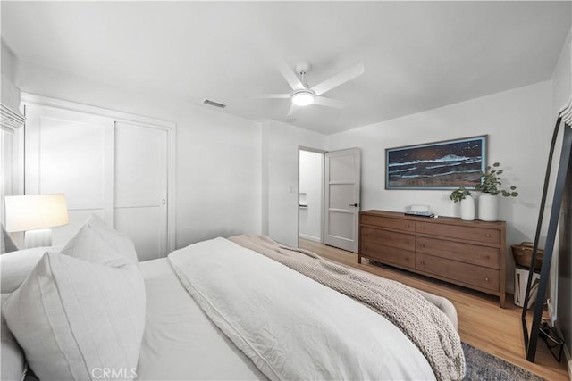 6335 Lorca Dr, San Diego, CA 92115 - bedroom featuring wood finished floors, a closet, and a ceiling fan