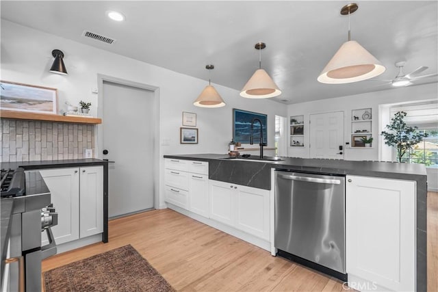 6335 Lorca Dr, San Diego, CA 92115 - kitchen with stainless steel dishwasher, dark countertops, light wood-style floors, and open shelves