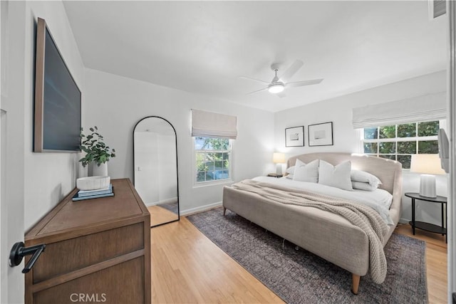 6335 Lorca Dr, San Diego, CA 92115 - bedroom featuring multiple windows, light wood-type flooring, and ceiling fan