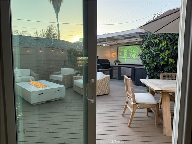 6335 Lorca Dr, San Diego, CA 92115 - wooden terrace with an outdoor fire pit, a grill, and outdoor dining space