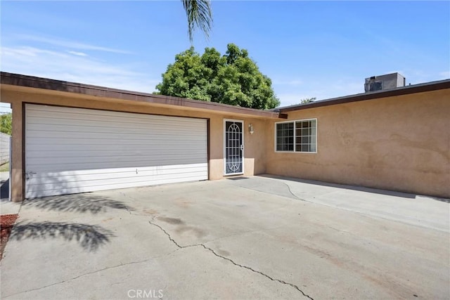 2616 Lynwood St, Bakersfield, CA 93306 - view of front of property featuring an attached garage, stucco siding, and concrete driveway
