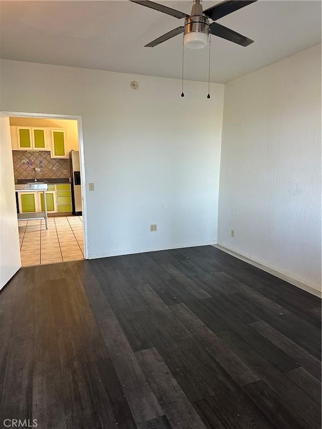 6896 Frontage Rd, Lucerne, CA 95458 - spare room with dark wood-style flooring and a ceiling fan