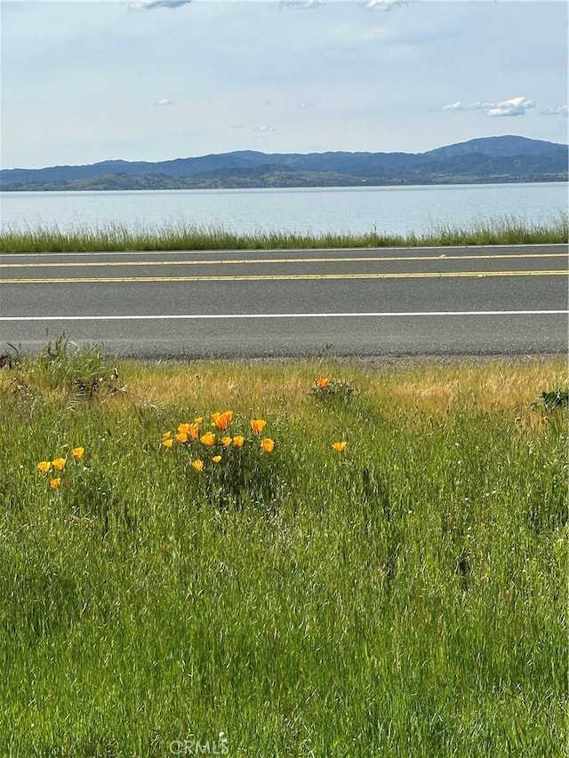 6896 Frontage Rd, Lucerne, CA 95458 - water view featuring a mountain backdrop