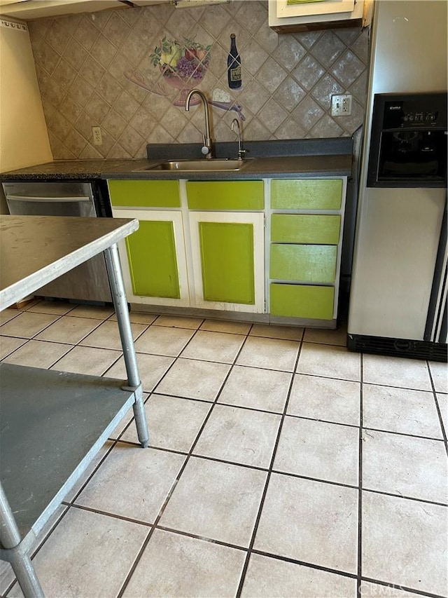 6896 Frontage Rd, Lucerne, CA 95458 - kitchen featuring appliances with stainless steel finishes, decorative backsplash, dark countertops, and light tile patterned flooring