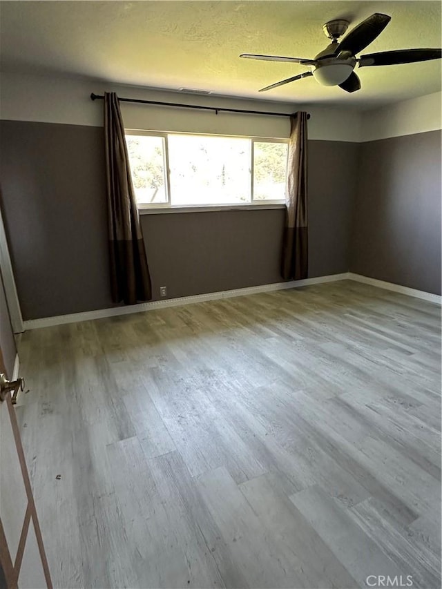 6896 Frontage Rd, Lucerne, CA 95458 - empty room featuring wood finished floors and ceiling fan