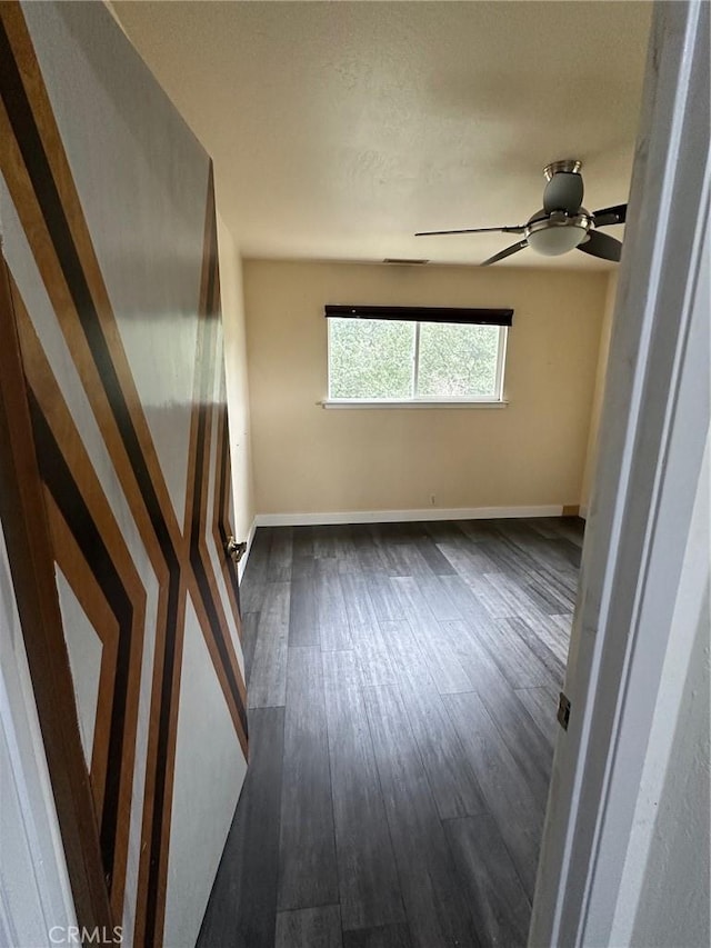 6896 Frontage Rd, Lucerne, CA 95458 - empty room featuring dark wood-style floors and a ceiling fan