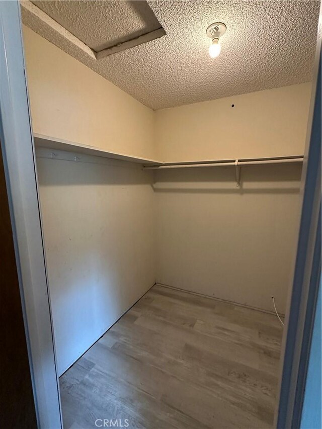 6896 Frontage Rd, Lucerne, CA 95458 - walk in closet with wood finished floors