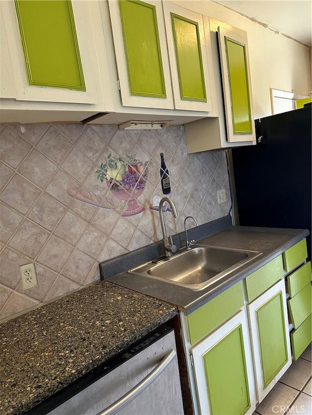 6896 Frontage Rd, Lucerne, CA 95458 - kitchen with dark countertops, tasteful backsplash, dishwasher, and freestanding refrigerator