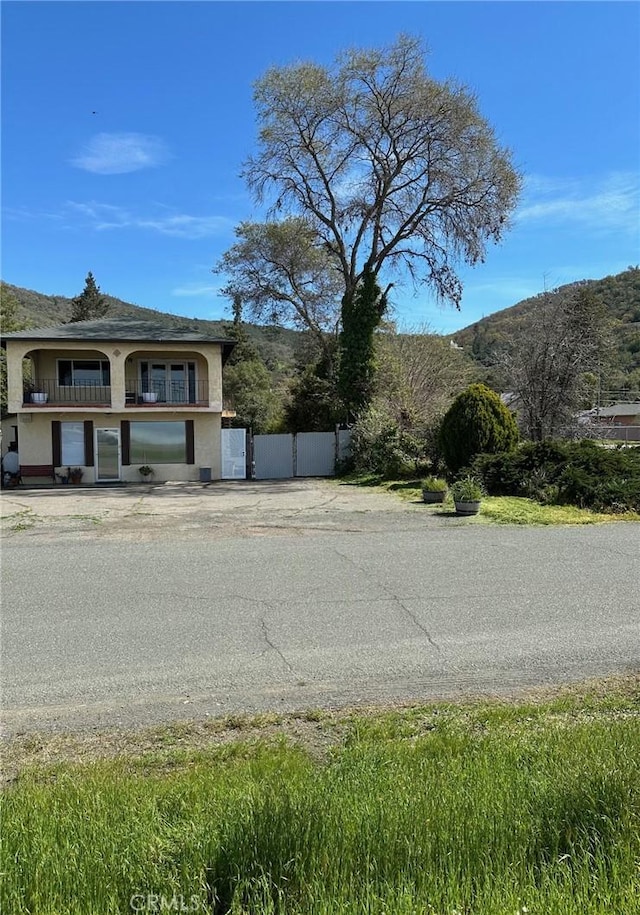 6896 Frontage Rd, Lucerne, CA 95458 - view of property exterior with a mountain view and stucco siding