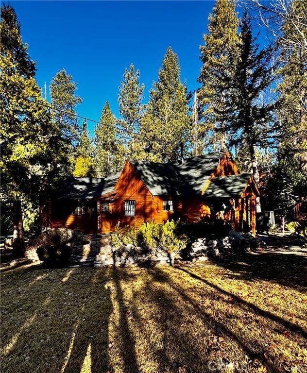 39654 Flicker Rd, Fawnskin, CA 92333 - view of home's exterior featuring a yard