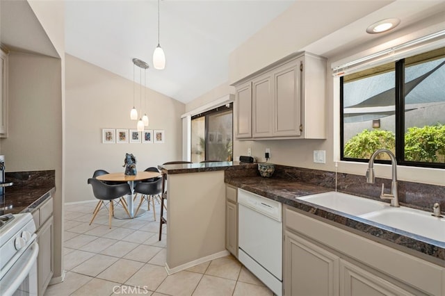 72760 Sage Ct, Palm Desert, CA 92260 - kitchen with white appliances, lofted ceiling, hanging light fixtures, light tile patterned floors, and a peninsula