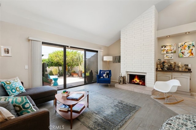72760 Sage Ct, Palm Desert, CA 92260 - living area featuring a brick fireplace, light wood-style floors, and high vaulted ceiling