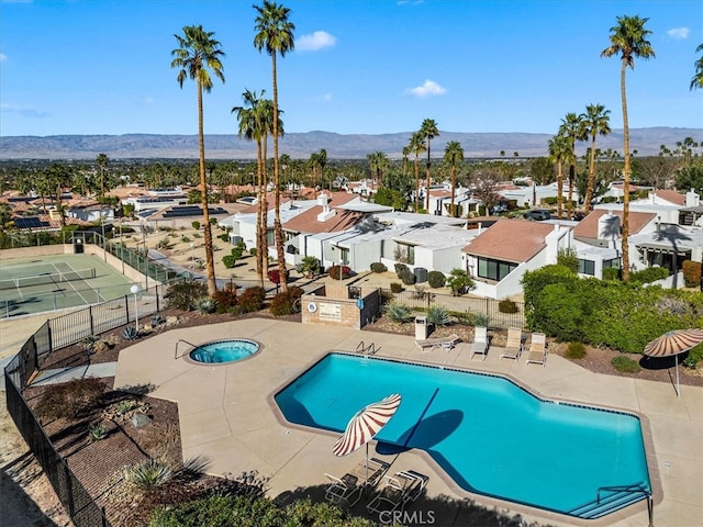 72760 Sage Ct, Palm Desert, CA 92260 - community pool with a residential view, a mountain view, and a patio area