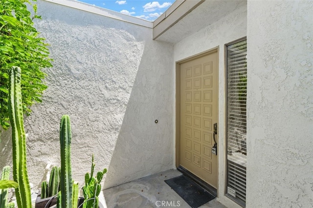 72760 Sage Ct, Palm Desert, CA 92260 - entrance to property featuring stucco siding