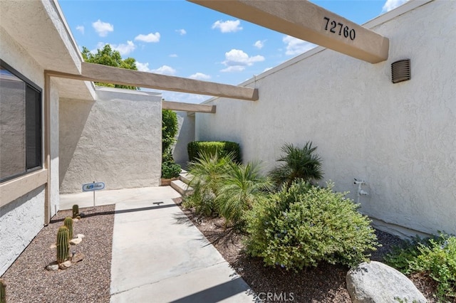 72760 Sage Ct, Palm Desert, CA 92260 - entrance to property featuring stucco siding