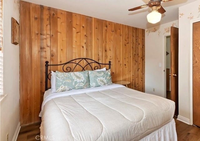 1126 Aleutian Dr, Lake Arrowhead, CA 92352 - bedroom with wood finished floors, wooden walls, and a ceiling fan