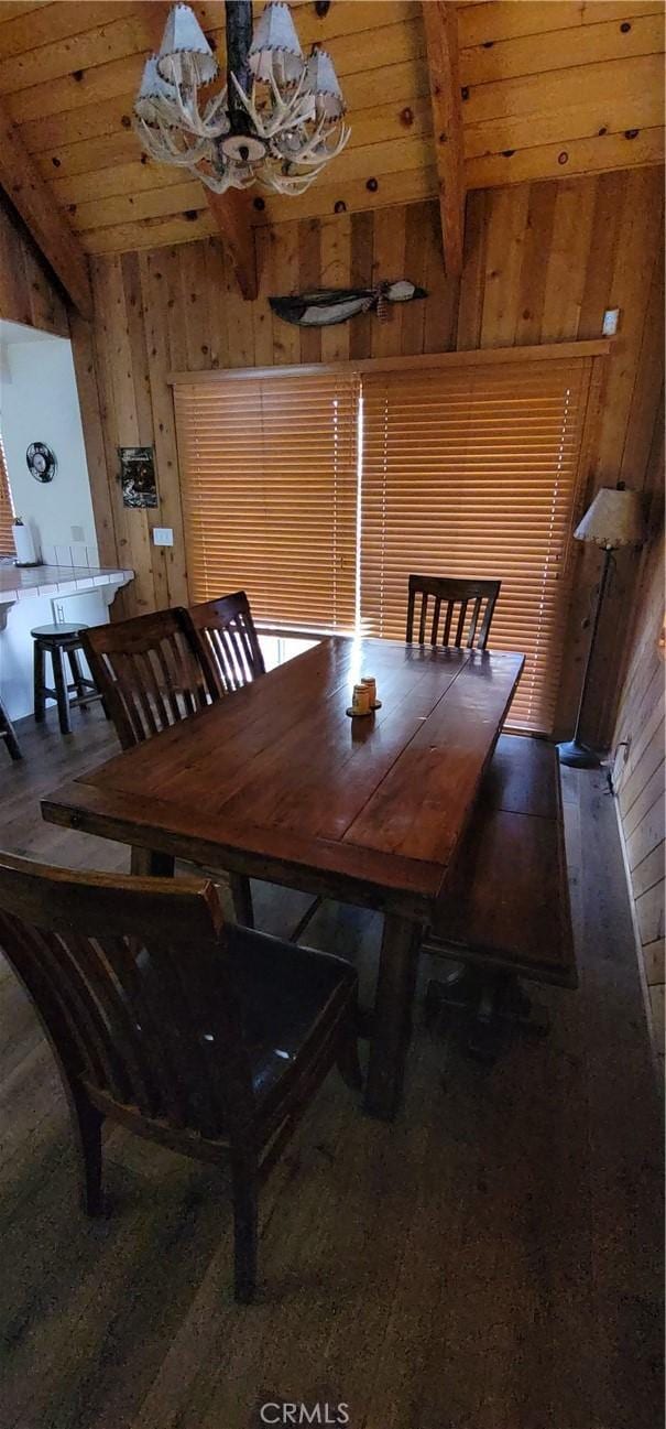 1126 Aleutian Dr, Lake Arrowhead, CA 92352 - dining room with wood walls, a wooden ceiling with exposed beams, and a chandelier