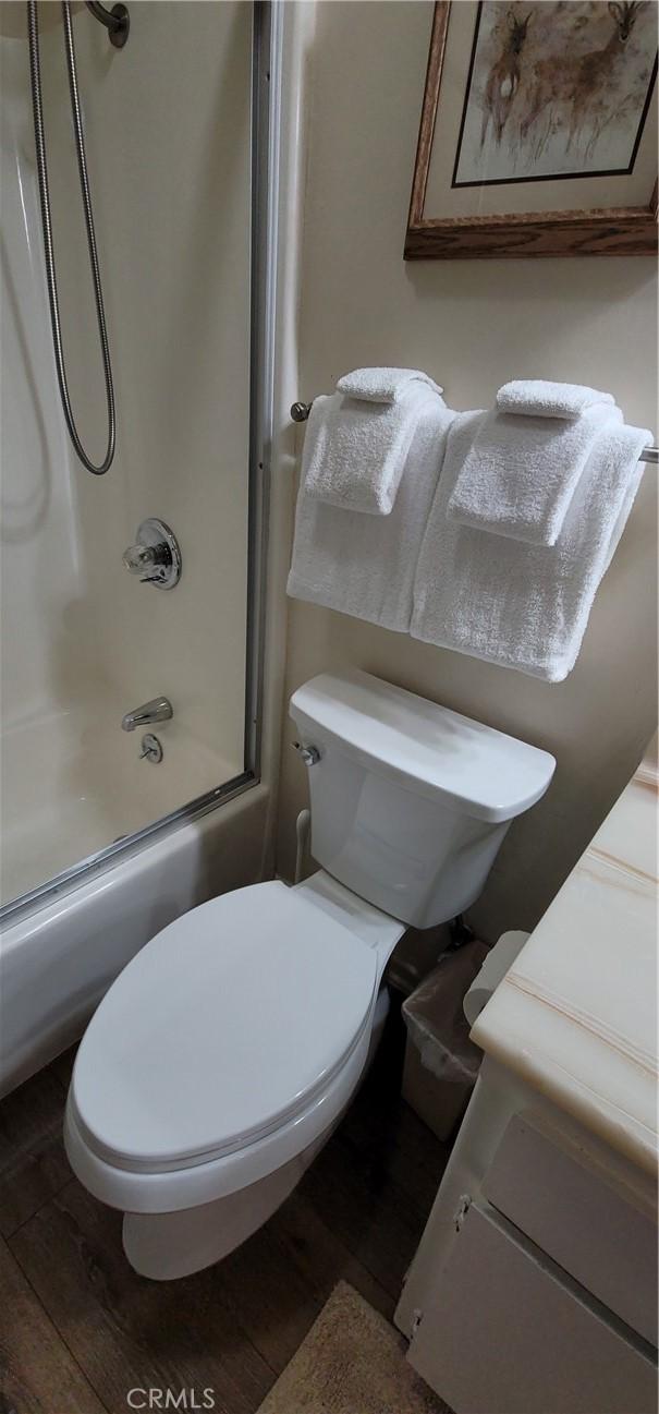 1126 Aleutian Dr, Lake Arrowhead, CA 92352 - full bath featuring  shower combination, wood finished floors, and vanity