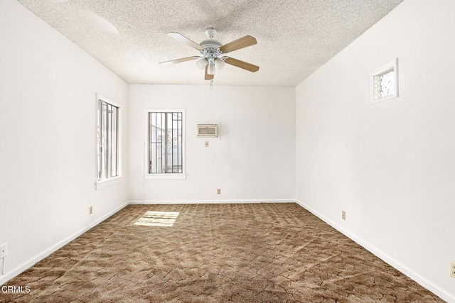 2710 W Shorb St, Alhambra, CA 91803 - spare room featuring carpet floors, ceiling fan, a textured ceiling, and an AC wall unit