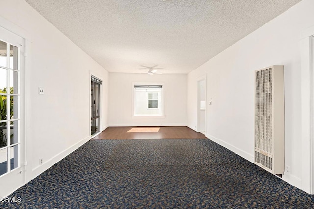 2710 W Shorb St, Alhambra, CA 91803 - empty room featuring a heating unit, dark colored carpet, and a textured ceiling