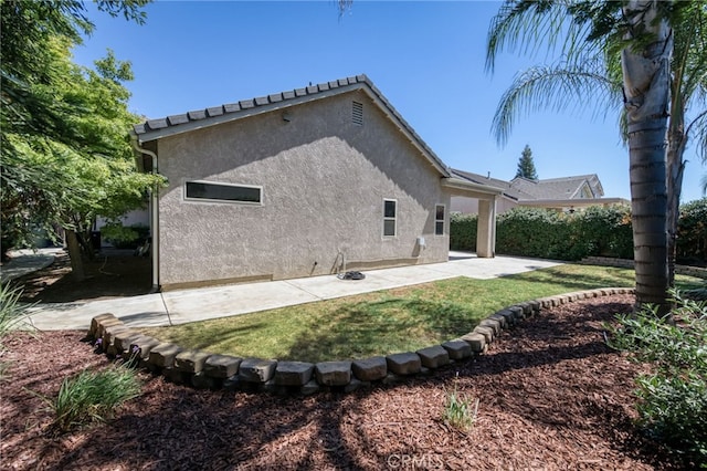 2925 E El Paso Ave, Fresno, CA 93720 - back of house with stucco siding, a patio, and a yard