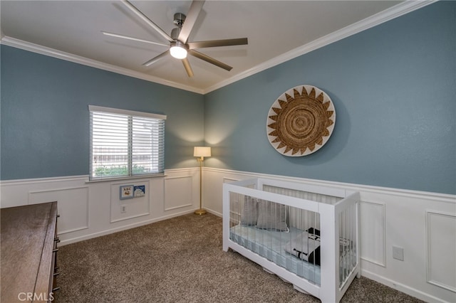 2925 E El Paso Ave, Fresno, CA 93720 - carpeted bedroom featuring a wainscoted wall, crown molding, a decorative wall, and ceiling fan