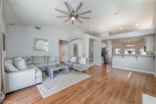 2925 E El Paso Ave, Fresno, CA 93720 - living area featuring vaulted ceiling, ceiling fan, light wood-type flooring, and recessed lighting