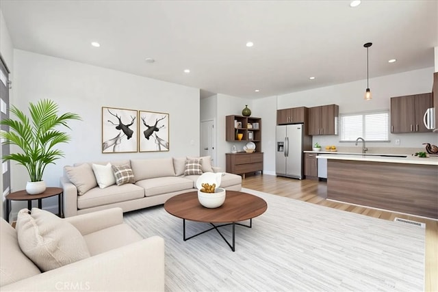 7820 Fulton Ave, North Hollywood, CA 91605 - living area with light wood-type flooring and recessed lighting