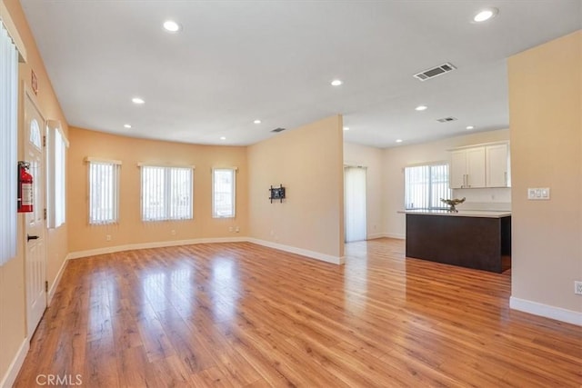 7820 Fulton Ave, North Hollywood, CA 91605 - unfurnished living room with light wood-style floors and recessed lighting