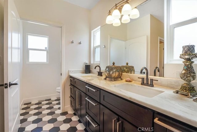 7820 Fulton Ave, North Hollywood, CA 91605 - bathroom featuring double vanity, a chandelier, and tile patterned floors
