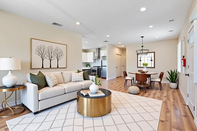 7820 Fulton Ave, North Hollywood, CA 91605 - living area featuring recessed lighting, light wood-style flooring, and a chandelier