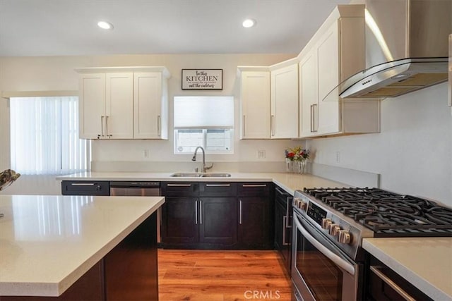 7820 Fulton Ave, North Hollywood, CA 91605 - kitchen featuring appliances with stainless steel finishes, wall chimney range hood, plenty of natural light, light countertops, and recessed lighting