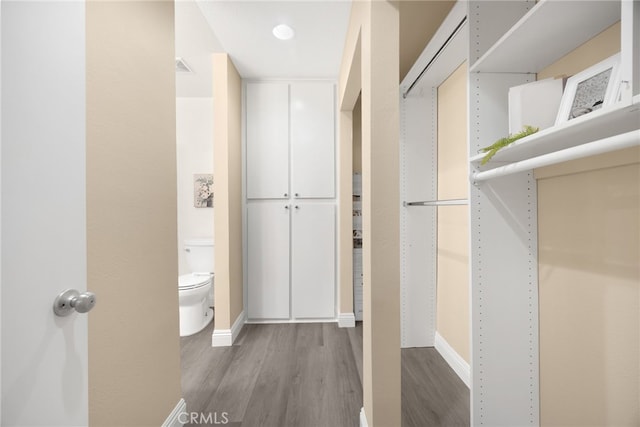 3020 Associated Rd Unit 110, Fullerton, CA 92835 - spacious closet with wood finished floors