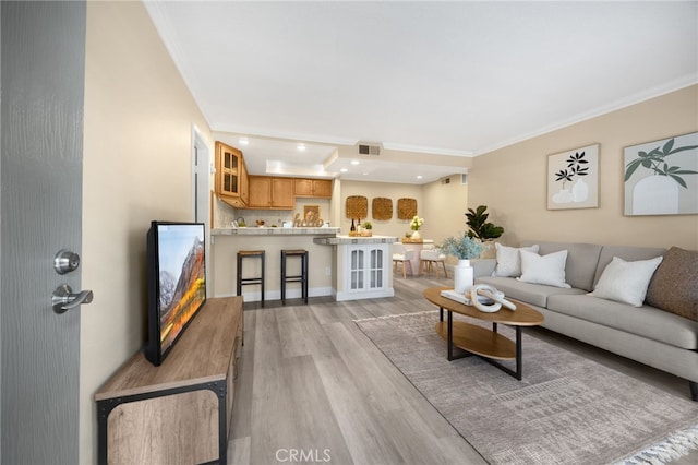 3020 Associated Rd Unit 110, Fullerton, CA 92835 - living room with light wood-style floors, ornamental molding, and recessed lighting