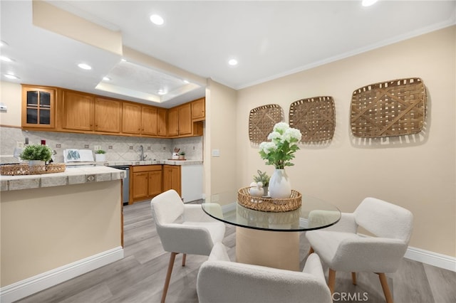 3020 Associated Rd Unit 110, Fullerton, CA 92835 - dining space with light wood-type flooring, recessed lighting, and crown molding