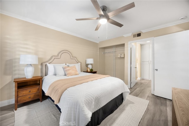 3020 Associated Rd Unit 110, Fullerton, CA 92835 - bedroom with a closet, light wood-type flooring, ornamental molding, and ceiling fan