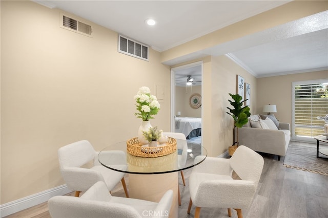 3020 Associated Rd Unit 110, Fullerton, CA 92835 - dining space with wood finished floors, crown molding, and recessed lighting